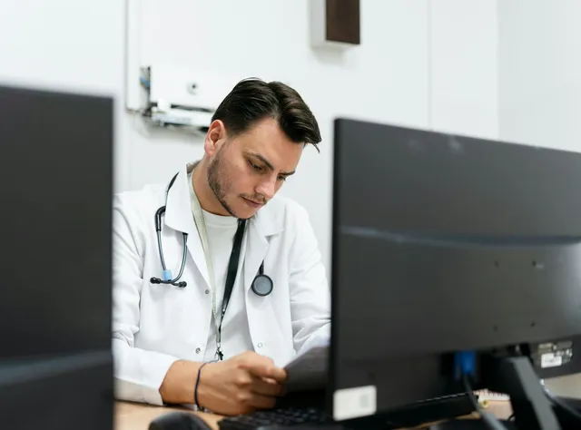 AHPRA-registered practitioner reviewing biomarker data